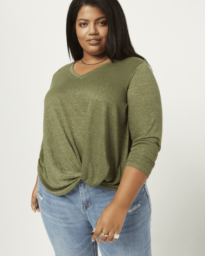 Front of a model wearing a size 1X Sonja Twist Hem Top in Olive Green by Molly & Isadora. | dia_product_style_image_id:210738